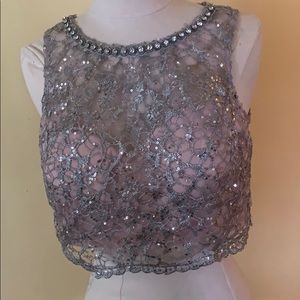 Lace cropped top studded with faux diamonds.